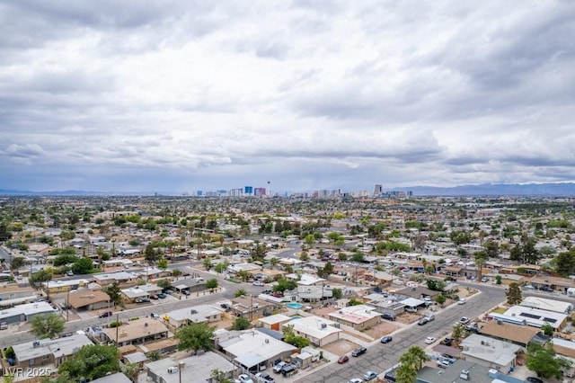aerial view of property's location with nearby urban area