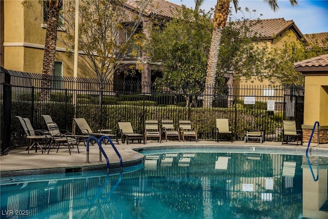 6868 Sky Pointe Dr Unit 1112, Las Vegas, NV 89131 - community pool with fence and a patio area
