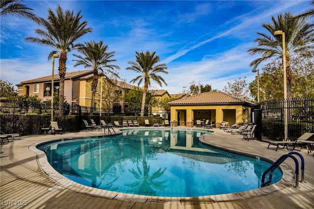 6868 Sky Pointe Dr Unit 1112, Las Vegas, NV 89131 - community pool featuring a patio and fence