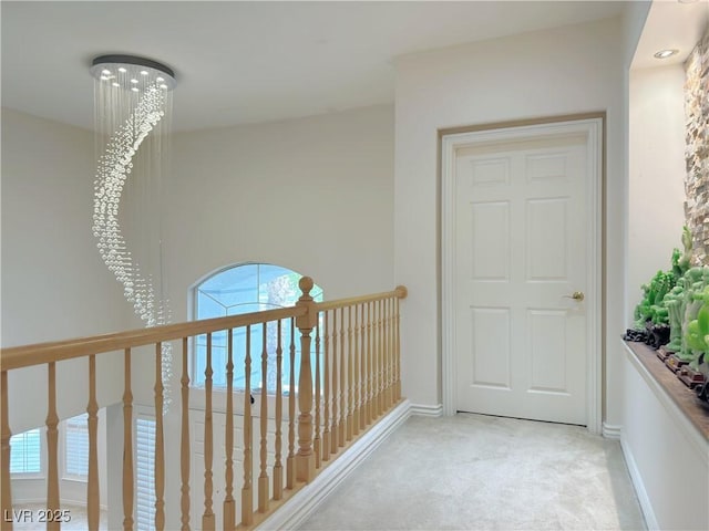 2451 Tour Edition Dr, Henderson, NV 89074 - hall featuring plenty of natural light, light colored carpet, and baseboards