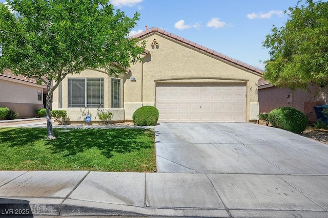 7755 Pacific Rim Ct, Las Vegas, NV 89139 - view of front of home with stucco siding, a garage, driveway, a front yard, and a tiled roof
