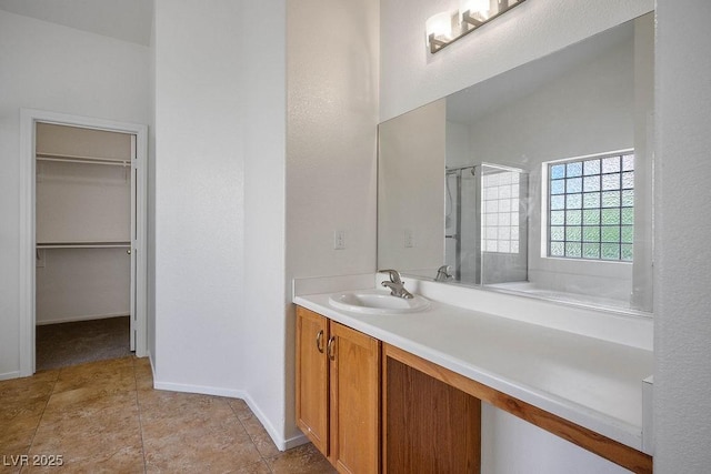 7755 Pacific Rim Ct, Las Vegas, NV 89139 - full bath with a shower stall, vanity, a spacious closet, and baseboards