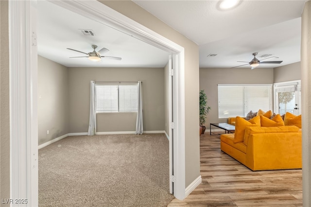 8100 Lake Hills Dr, Las Vegas, NV 89128 - living room with ceiling fan, baseboards, and carpet