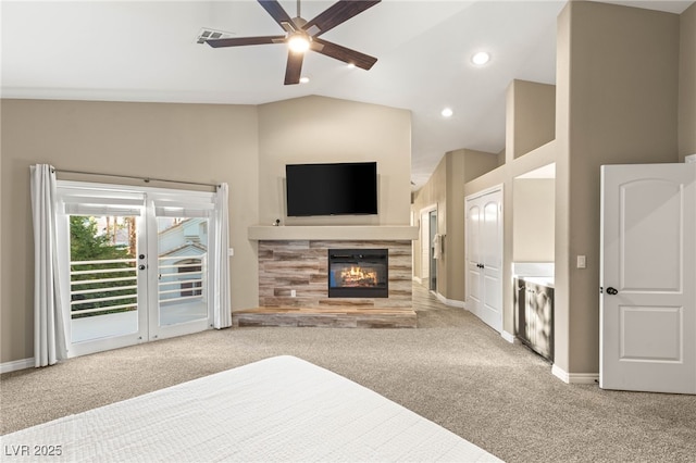 8100 Lake Hills Dr, Las Vegas, NV 89128 - unfurnished living room with lofted ceiling, carpet floors, a ceiling fan, a tile fireplace, and baseboards