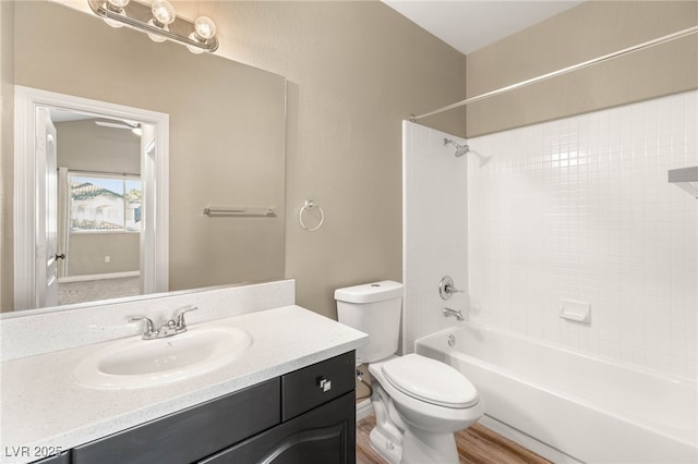 8100 Lake Hills Dr, Las Vegas, NV 89128 - full bathroom featuring vanity, toilet, bathtub / shower combination, and wood finished floors