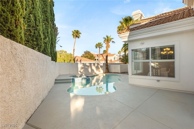 8100 Lake Hills Dr, Las Vegas, NV 89128 - view of swimming pool featuring a patio area, a fenced backyard, and a pool with connected hot tub