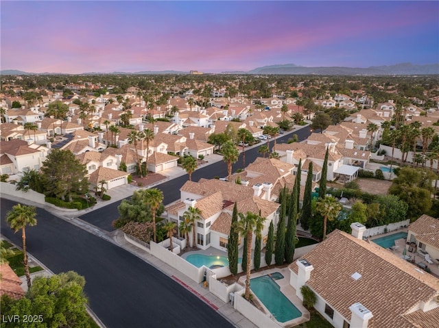 8100 Lake Hills Dr, Las Vegas, NV 89128 - aerial view at dusk of view of pool area, a residential view, and a mountain view