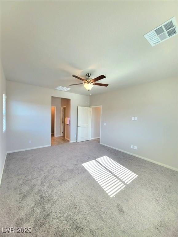 unfurnished bedroom with carpet floors, baseboards, and a ceiling fan