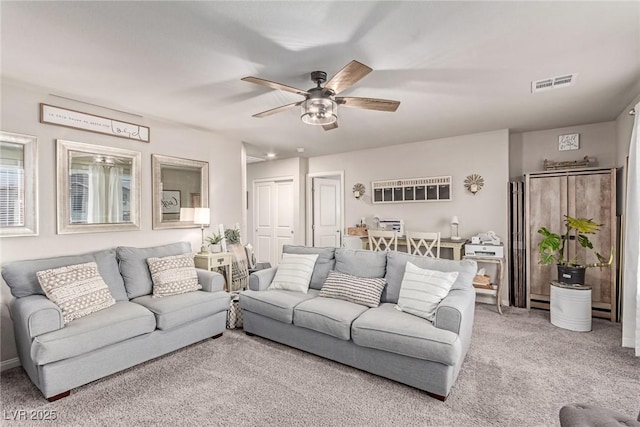 living room with carpet and ceiling fan