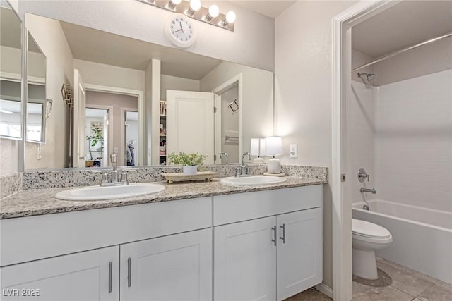 full bathroom featuring double vanity, toilet, and shower / bathtub combination