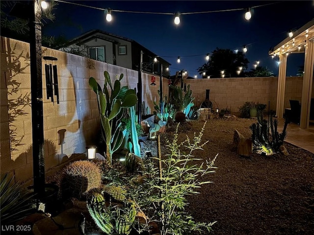 yard at night with fence
