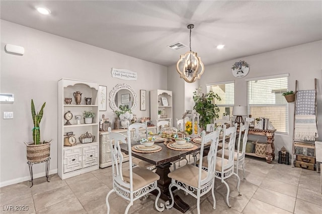 dining space featuring a chandelier and light tile patterned floors