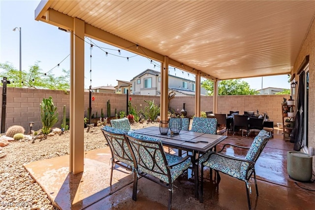view of patio / terrace with outdoor dining space and a fenced backyard