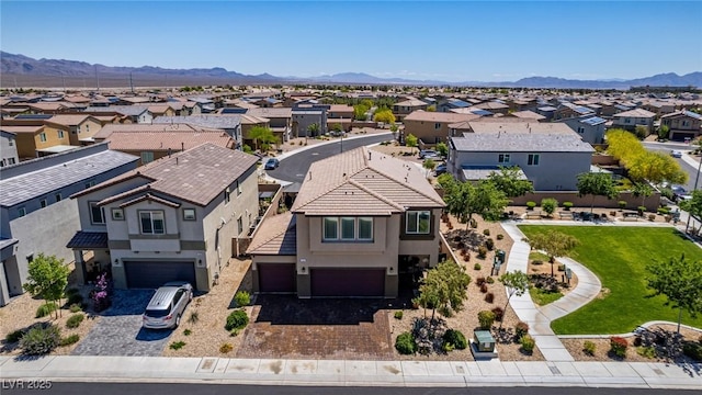aerial view of residential area featuring a mountain backdrop