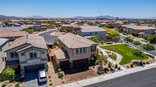 aerial perspective of suburban area with a mountainous background