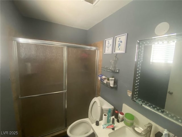 1841 Skywood Way, Las Vegas, NV 89142 - full bathroom featuring a stall shower, toilet, and a sink