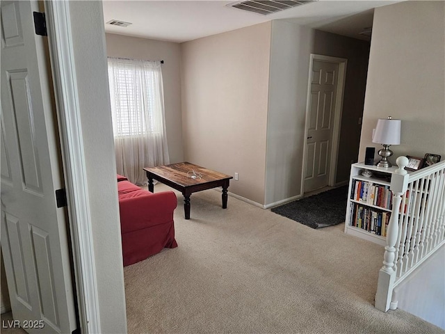 living area with carpet flooring and baseboards