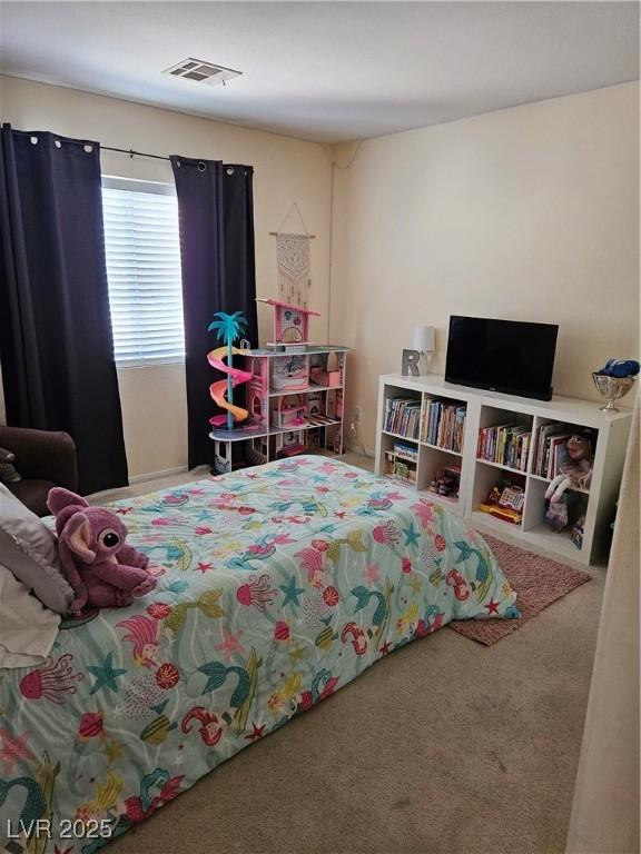 bedroom featuring carpet