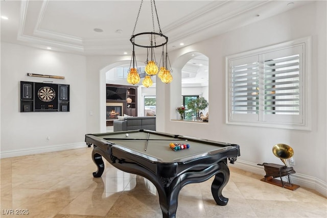 playroom featuring arched walkways, a raised ceiling, billiards table, ornamental molding, and recessed lighting