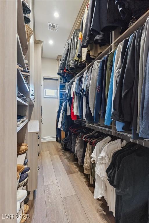 spacious closet with wood finished floors