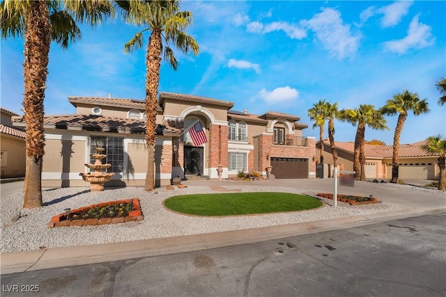 1316 Eagle Meadow Ct, Las Vegas, NV 89123 - mediterranean / spanish-style home with stucco siding, curved driveway, and a tile roof