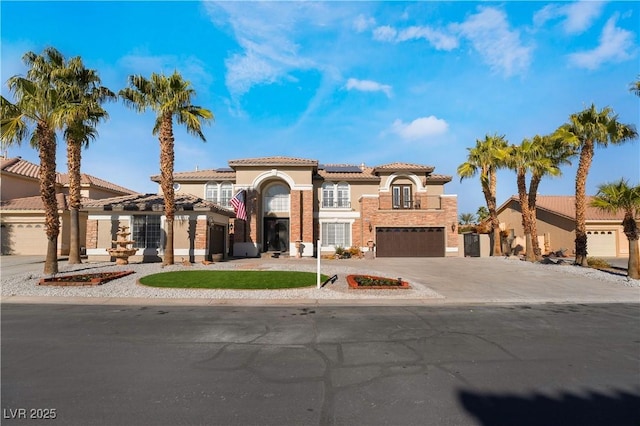 1316 Eagle Meadow Ct, Las Vegas, NV 89123 - mediterranean / spanish home with stucco siding, concrete driveway, solar panels, a tiled roof, and an attached garage