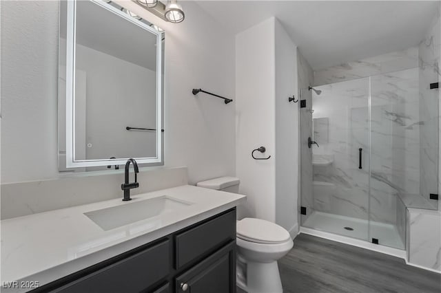 1316 Eagle Meadow Ct, Las Vegas, NV 89123 - full bathroom with toilet, a marble finish shower, vanity, and wood finished floors