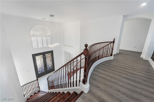 1316 Eagle Meadow Ct, Las Vegas, NV 89123 - staircase featuring wood finished floors, french doors, arched walkways, baseboards, and recessed lighting