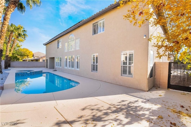 1316 Eagle Meadow Ct, Las Vegas, NV 89123 - view of swimming pool featuring a patio, a fenced backyard, and a pool with connected hot tub