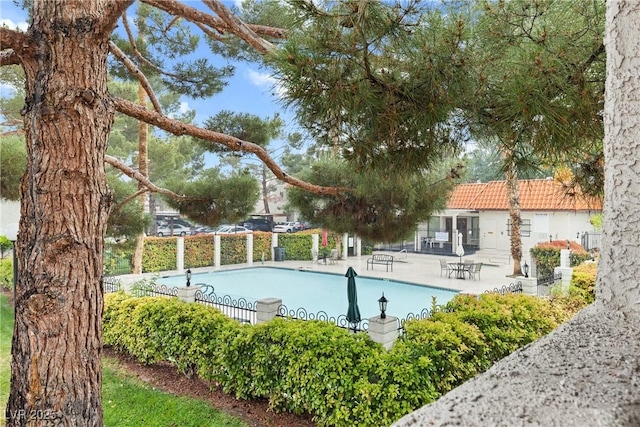 community pool with a patio