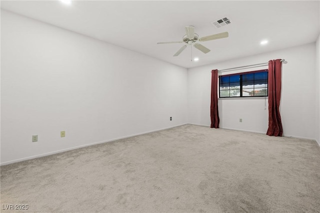 carpeted spare room featuring recessed lighting, ceiling fan, and baseboards
