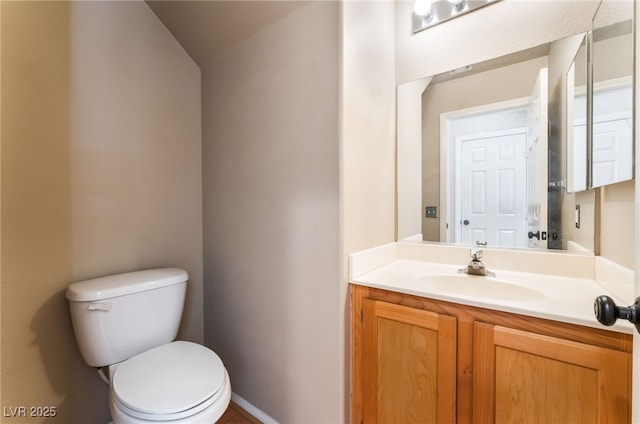 9360 Canalino Dr, Las Vegas, NV 89134 - half bathroom featuring toilet, vanity, and vaulted ceiling