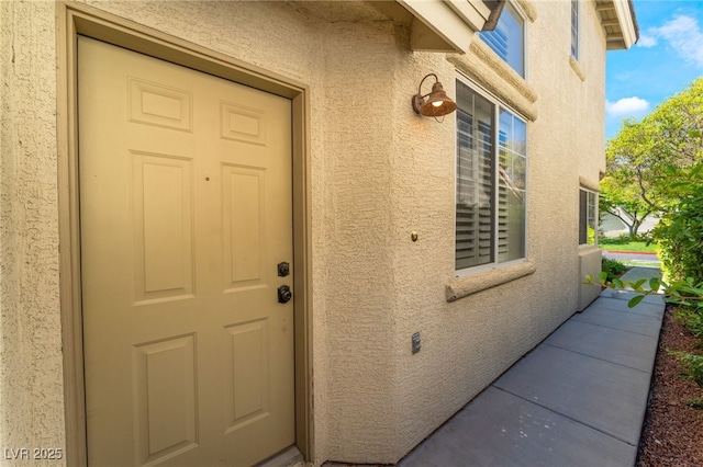 9360 Canalino Dr, Las Vegas, NV 89134 - doorway to property featuring stucco siding