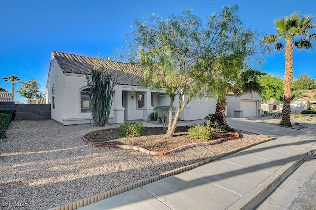 832 Seco Verde Ave, Henderson, NV 89015 - view of front facade featuring stucco siding, fence, and a tiled roof