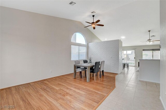 832 Seco Verde Ave, Henderson, NV 89015 - dining area with ceiling fan, baseboards, light tile patterned floors, and high vaulted ceiling