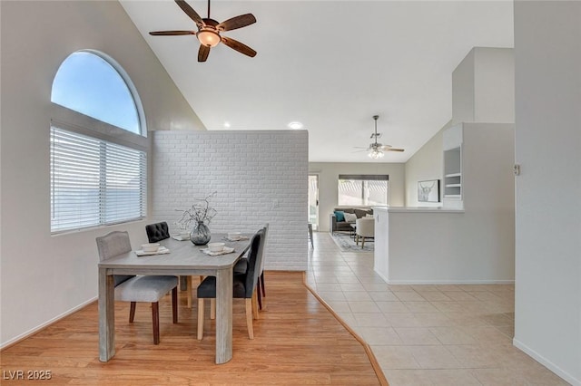 832 Seco Verde Ave, Henderson, NV 89015 - dining area featuring a ceiling fan, high vaulted ceiling, baseboards, and light tile patterned floors