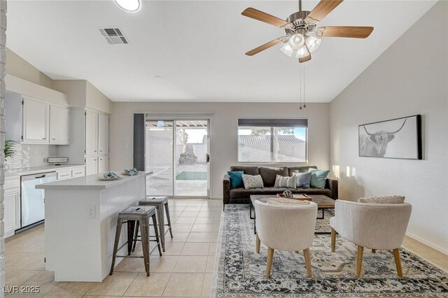 832 Seco Verde Ave, Henderson, NV 89015 - living room featuring vaulted ceiling, a ceiling fan, and light tile patterned flooring