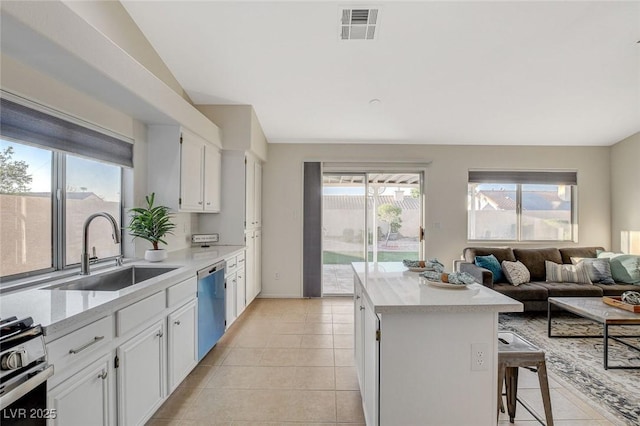 832 Seco Verde Ave, Henderson, NV 89015 - kitchen featuring a sink, appliances with stainless steel finishes, light countertops, light tile patterned floors, and white cabinets