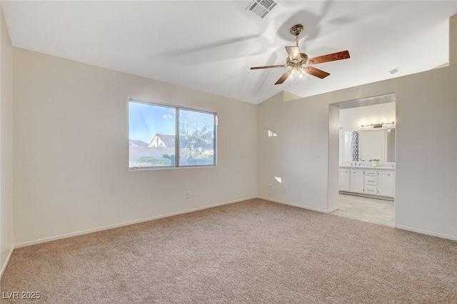 832 Seco Verde Ave, Henderson, NV 89015 - empty room with light carpet, a ceiling fan, lofted ceiling, and baseboards