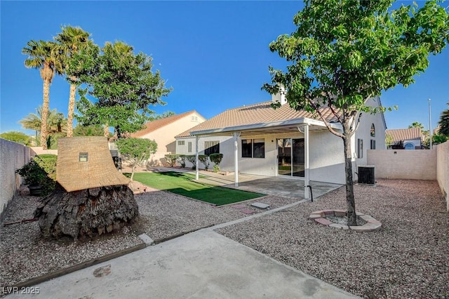 832 Seco Verde Ave, Henderson, NV 89015 - back of property with stucco siding, a fenced backyard, and a patio area
