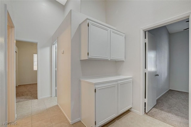 832 Seco Verde Ave, Henderson, NV 89015 - hall with light carpet, light tile patterned floors, and baseboards
