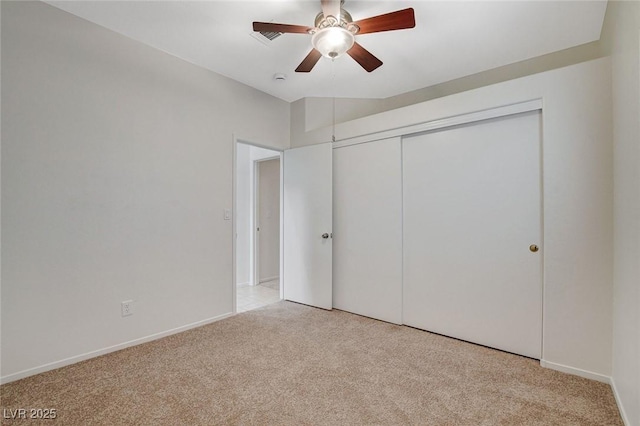 832 Seco Verde Ave, Henderson, NV 89015 - unfurnished bedroom with light carpet, a closet, ceiling fan, and baseboards