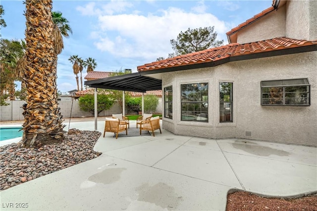 view of patio / terrace with an outdoor living space and a fenced backyard