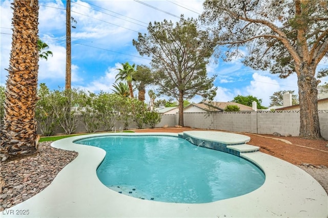 view of swimming pool featuring a fenced backyard