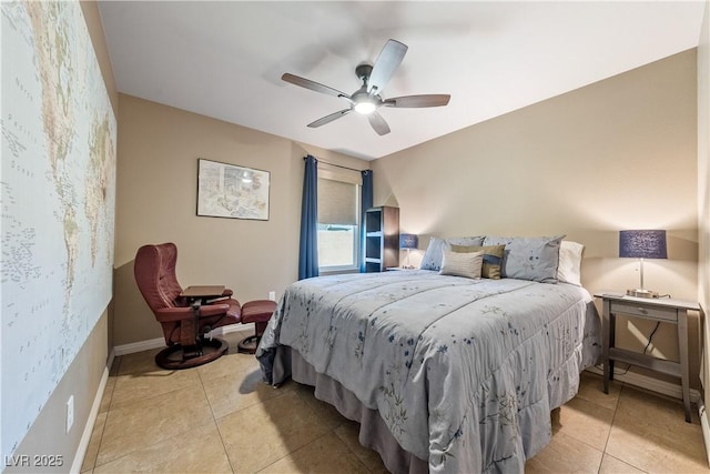 3966 E Garfield Dr, Pahrump, NV 89061 - bedroom with light tile patterned floors, a ceiling fan, and baseboards