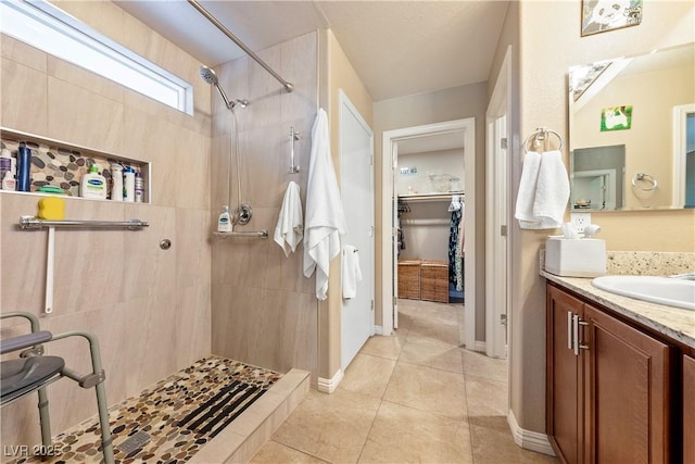 3966 E Garfield Dr, Pahrump, NV 89061 - full bath with tiled shower, tile patterned floors, vanity, and baseboards