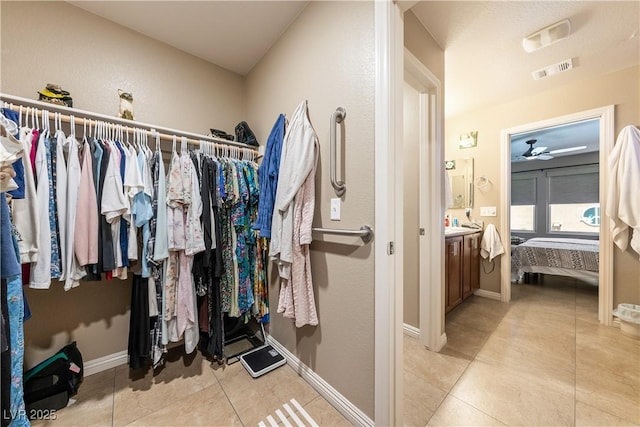 3966 E Garfield Dr, Pahrump, NV 89061 - walk in closet with light tile patterned floors and ceiling fan