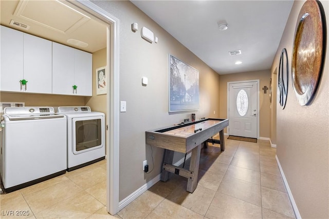 3966 E Garfield Dr, Pahrump, NV 89061 - washroom featuring independent washer and dryer, cabinet space, baseboards, and light tile patterned floors