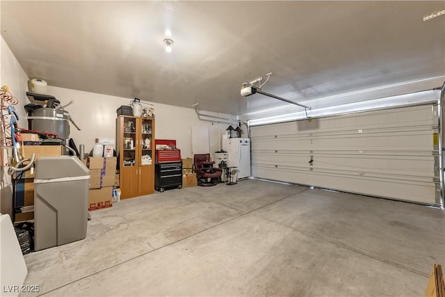 3966 E Garfield Dr, Pahrump, NV 89061 - garage featuring a garage door opener and freestanding refrigerator