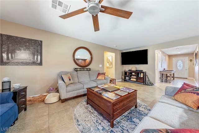 3966 E Garfield Dr, Pahrump, NV 89061 - living room featuring light tile patterned flooring, ceiling fan, and baseboards